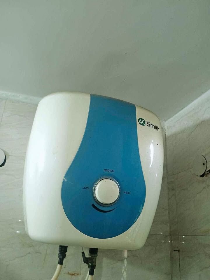 Close view AO SDS Green 15 Litre 5 Star Geyser installed wall mounted in bathroom