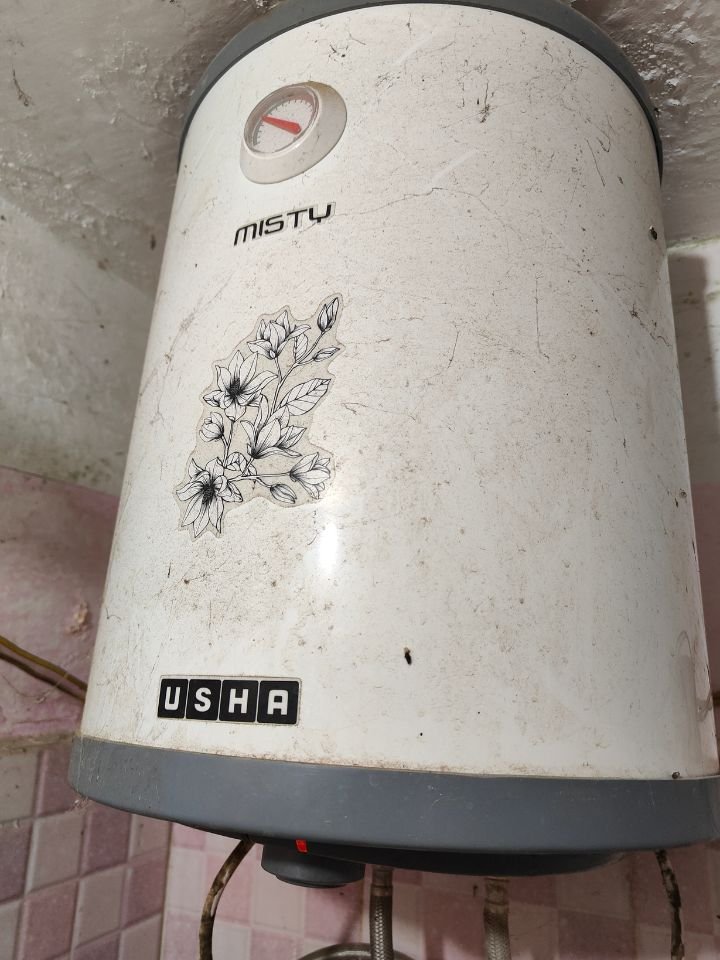 Close view of Usha Misty 15 Ltr Vertical water heater installed in wall mounted 